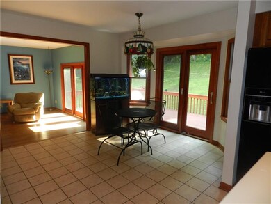 This eat in kitchen opens onto the large deck and 