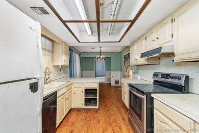 Kitchen is to the left as you walk in the front do