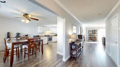 Walk in to your entryway leading to your kitchen on the left and leading straight to the two living spaces.