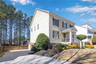 View of front of house featuring concrete driveway