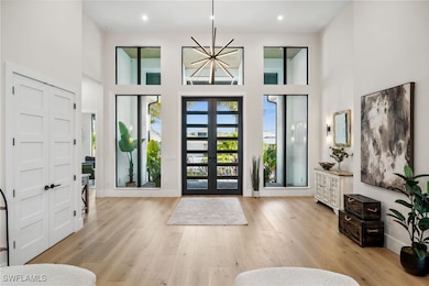 Entrance foyer featuring recessed lighting, french