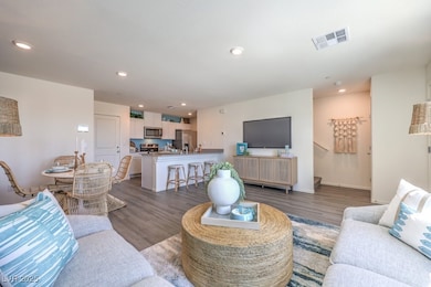 Living room featuring wood finished floors, recess
