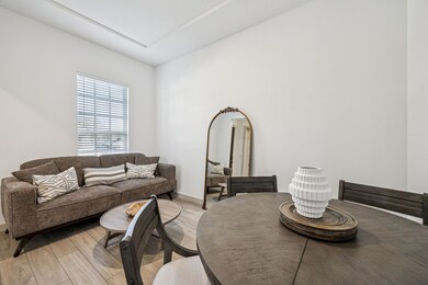 Living room featuring wood finished floors and baseboards