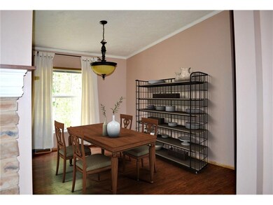 The light-filled dining room is open to both the l
