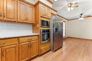 A closer view of the Kitchen looking into Dining area.