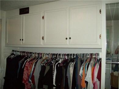 Storage Cabinets and closet in laundry room.  