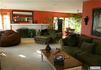 Living Room with Brick Fireplace.