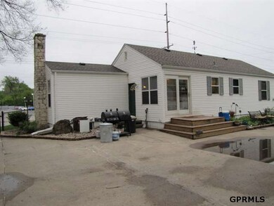The back patio opens to the back yard and features easy entry to the house through the sliding glass doors.  It also has a basketball goal.  Great for family get togethers and barbecues!