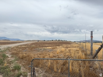 View of yard featuring a view of countryside and a mountain view
