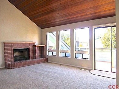 Many windows and sliding glass door allow natural 