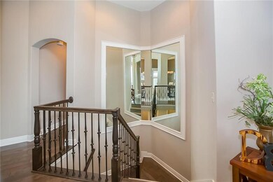 Mirrored stair case with metal spindles with upgra