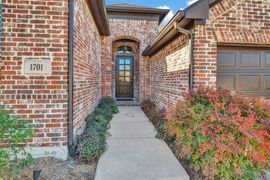 Brick and bedding lined entry protects visitors fr