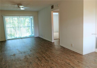 View of living-dining room and screened patio from