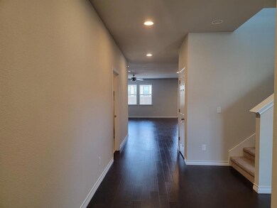 Corridor with recessed lighting, dark wood-style 