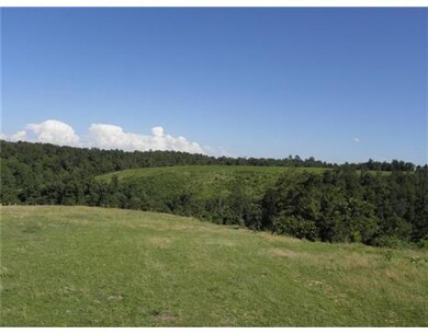 Land. Rolling ridges are cleared for pasture.
