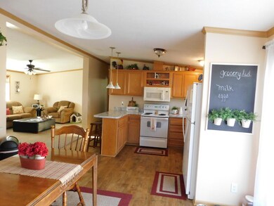 Side entry hall leads to dining/kitchen & living a
