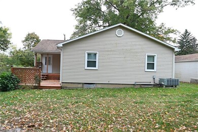 Rear view of house featuring heat pump/ a/d, a law