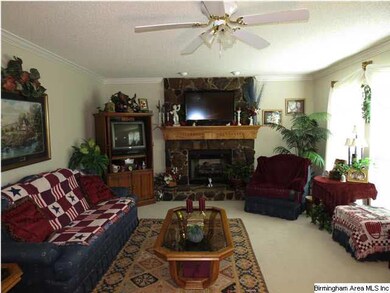 Nice sized living room with gas log fireplace