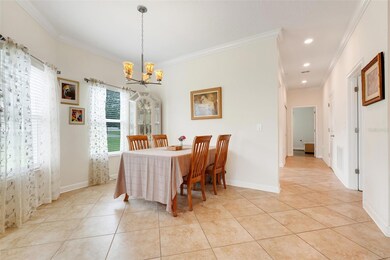 Enjoy elegant dinners or casual gatherings in this well-proportioned dining room, filled with warm, natural light.