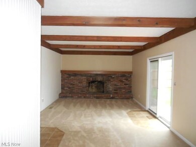 brick wall fireplace highlights your family room.. sliding doors lead to your deck and just steps away from your pool...