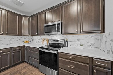 Designer Backsplash brightens the room.