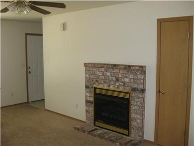 Living Room. Spacious living area with gas log fireplace in each unit.