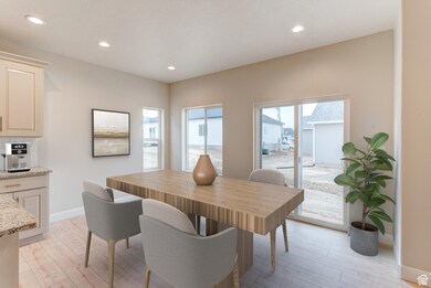 Dining area with recessed lighting and light wood finished floors