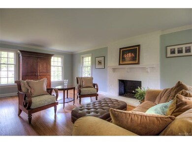 The formal living room has plenty of natural light