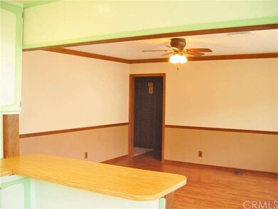 The living room adjoins the kitchen, family room a