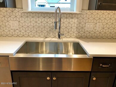close up of sink and backsplash