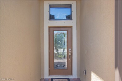 Leaded glass front door and transom window to let