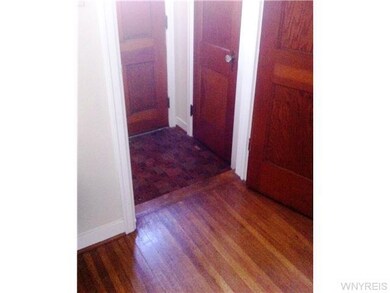 Living Room Front entry with closet origianl expos