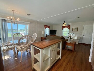 Gorgeous View: Standing at stove looking out patio to pond