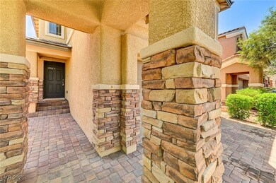 Doorway to property featuring stucco siding and st