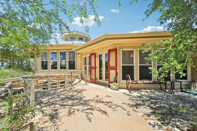 Rear view of property featuring a patio and frenc