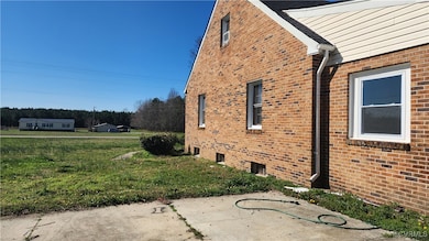 View of side of property with brick siding