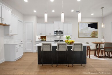 Kitchen with decorative backsplash, light counter