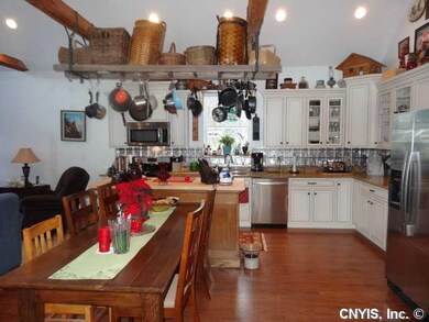 Kitchen. Kitchen & Dining area on approach.  Go wi