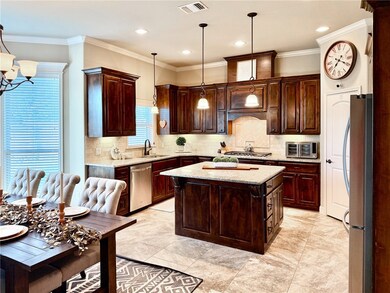 Kitchen featuring tasteful backsplash, recessed li