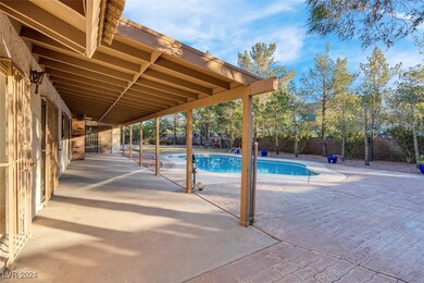 Ample covered patio on this nearly half acre lot w
