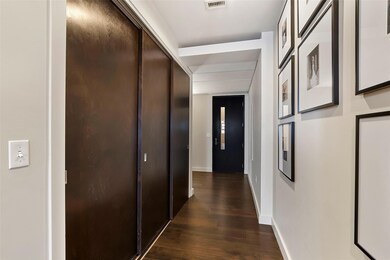 Hallway featuring hardwood flooring