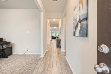 Beautiful upgraded wood-look tile greets you as yo