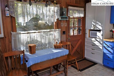 Kitchen door leads to side deck with access to the