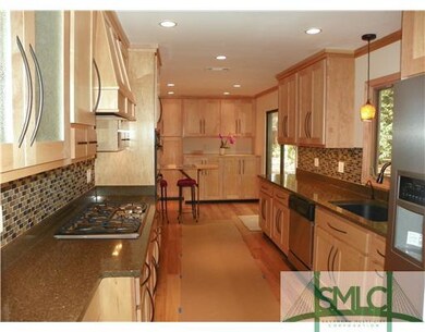 Kitchen. Custom crafted Maple cabinets. Sleek quar