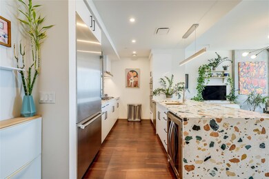 Kitchen featuring built in refrigerator, wine coo