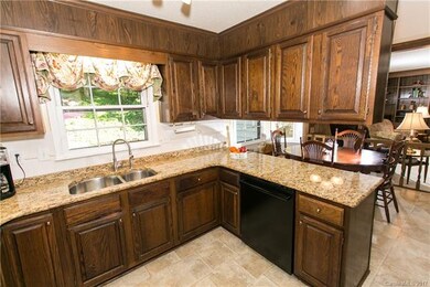 The kitchen has lots of cabinets, providing plenty