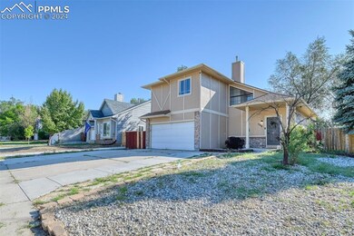 View of property featuring a garage