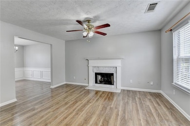 Unfurnished living room featuring light wood-type 