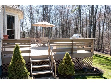 Another view of deck shows the lovely wooded area 