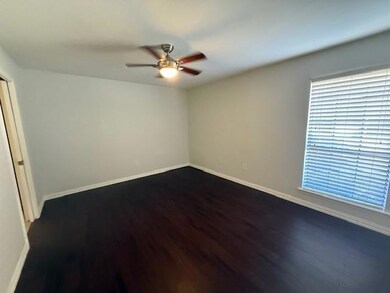 Spare room featuring dark hardwood / wood-style fl